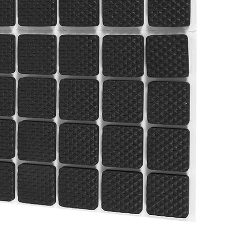 Close-up of 48 Pack Black Rubber Floor Protectors Self-Adhesive Non-Slip Pads for Furniture and Appliances on white sheet