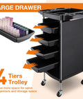 Mobile Hair Salon Tool Cart With Six Layer Design On Wheels, showing large drawers and trays, black color, for spa and tattoo studios.