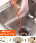 Hand using 4 Pack 19.6 Inch Drain Snakes Hair Clog Remover Flexible Barbed Wand For Unclogging Shower And Sink Drains Grab Hair Debris Easy To Use Durable Plastic Build Makes It A Quick Reusable Home Plumbing Fix For Tough Clogs in a sink.