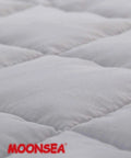 Close-up of Cozy Toddler Nap Mat with Removable Pillow and Fleece Minky Blanket Grey surface texture