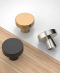 Brushed Satin Nickel Cabinet Knobs Six Pack Zinc Alloy Drawer Pulls in black, gold and silver finishes on a wooden surface.