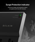 Close-up of Eight Outlet Surge Protector With Eight Foot Flat Plug 2500 Joules Of Protection UL Listed showing LED indicator.