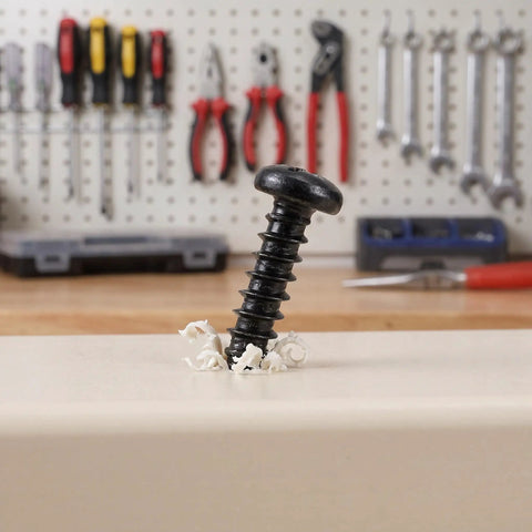 Grab These Happyyami M4x14mm Black Pan Head Self Tapping Screws With Cross Recess And Flat Point, standing on a workbench with shavings.