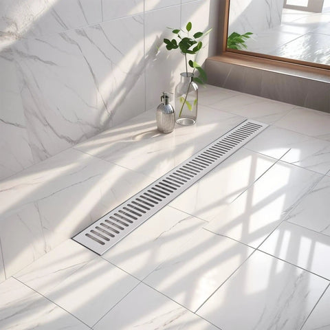 Slick Matte Black Linear Shower Drain Cut From Heavy Duty 304 Stainless Steel Boasts A Built In Siphon And Detachable Hair Strainer Plus Leveling Feet For Smooth Install In Showers Kitchens And Garages Providing A 600Mm Length on a tiled bathroom floor.