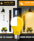 Dusk To Dawn Amber Bug Light Bulbs Outdoor Four Pack Auto On Off 10W 100W Equivalent E26 Base seen in outdoor lighting setup.