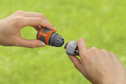Hands connecting 5/8 Inch Faucet End Hose Repair Quick Connector With Water Stop For Garden Hoses Between Tap And Hose Fittings 3/4 Inch.