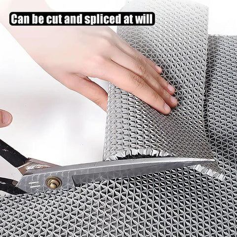 Hella Tough Non Slip Pvc Floor Mat, Cuttable Poolside Runner For Garage And Commercial Spaces, Super Water Draining Vinyl Rug With Killer Grip, Gray 3 By 35 Feet being cut with scissors.