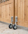 8 Inch Spring Loaded Gate Caster With 360 Degree Swivel Built To Last Heavy Duty 375 Lb Capacity, Solid Rubber Flat Free Wheel, Universal Mount For Farm Driveway Wood And Metal Tube Gates installed on wooden gate
