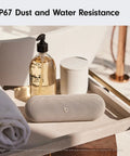 Pill Wireless Bluetooth Speaker And Portable USB C Charger With All Day Battery Life IP67 Water Resistant in bathroom setting