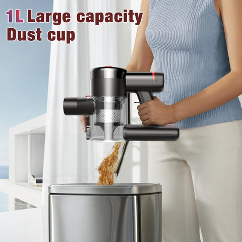 Woman emptying dust cup from cordless vacuum cleaner with 450W motor and 40KPa max suction, 50 minute run time, into bin