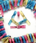 All In One 220 Piece Wire Spade Connectors Kit With Heat Shrink Terminals arranged in triangle pattern, colorful connectors