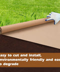 4 By 100 Feet Biodegradable Paper Weed Barrier For Landscaping Heavy Duty Landscape Fabric being rolled out on soil