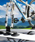Car with Suction Cup Car Roof Bike Rack With Quick Release, Aluminum Alloy Bike Carrier For One Bike on flat roof in landscape.