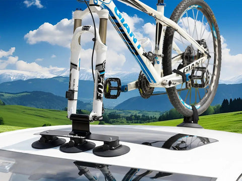 Car with Suction Cup Car Roof Bike Rack With Quick Release, Aluminum Alloy Bike Carrier For One Bike on flat roof in landscape.