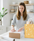 Woman in kitchen with 10 Inch Gift Bag Set 4 Pack With Tissue Paper Cards Envelopes And Handles Reusable Non Woven Gift Bags