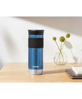 Snapseal Insulated Stainless Steel Travel Mug 20oz With Grip Lid in Blue Corn color on a table with a notepad.