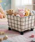 Heavy Duty Rolling Storage Basket For Toys holding plush bears and bunnies on smooth swivel caster wheels in playroom.