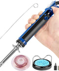 Hand holding All In One Desoldering Iron And Solder Sucker Tool For PCB Repair With 1.0mm And 1.2mm Nozzles, showing accessories