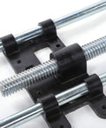 Heavy Duty Steel Front Mount Shop Vise For Workshop Bench Clamping And Woodworking Projects Built Tough As Nails close-up of threaded rod and mounting brackets.