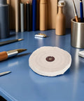 Heavy Duty Cotton Buffing Wheel Set For Metal And Stone Polishing With 144mm Diameter And 12mm Arbor Hole on a blue desk.
