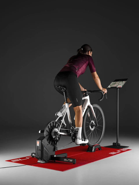 Cyclist on bike using Rivo Direct Drive Smart Trainer For Indoor Cycling With Accurate Power Within 2.5 Percent, Auto Resistance, 18 Percent
