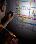 Person using Aluminum 100 Lumen Pen Light With Clip IP67 Waterproof Dustproof Trueview High Definition Output 6000 Series Aircraft Aluminum Construction Compact EDC Tool Light to examine a map.