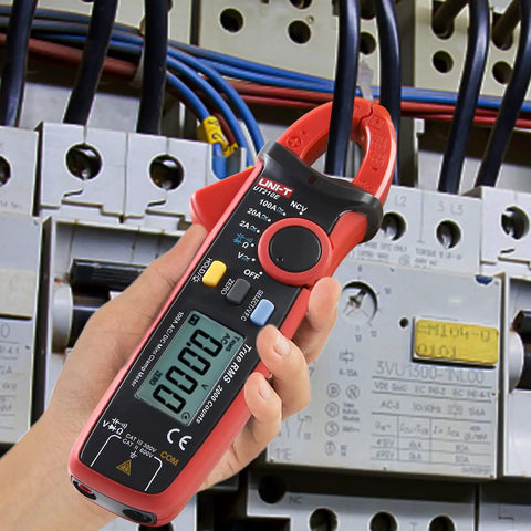 Clamp Meter Multimeter With Non Contact Voltage Tester For 2A AC DC being used on electrical panel, LCD Display visible.