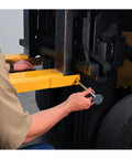 Installing Heavy Duty Pin Lock Forklift Extensions Boss Level Steel Bars 4000 Lb Capacity on a forklift for easy mounting.