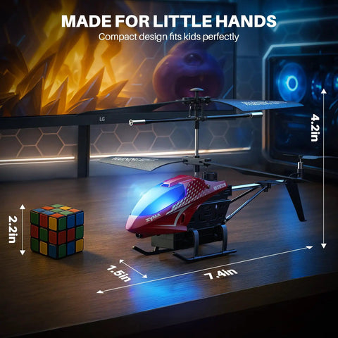 Remote Control RC Helicopter With 40 Minute Flight Time And Dual Batteries on table with Rubik's cube, LED lights glow