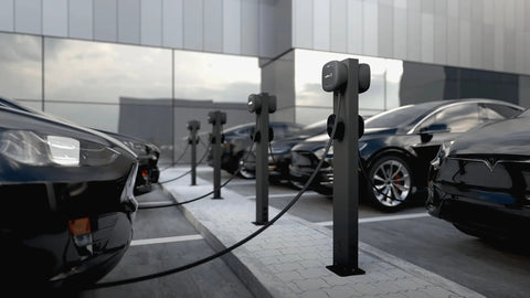 Built Like A Tank Rock Solid Weatherproof EV Charger Pedestal Stand Mount For Dual Electric Car Stations in a parking area.