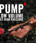 Hand holding High Pressure 300 PSI Shock Pump for mountain and road bikes with precise dial gauge and T handle.