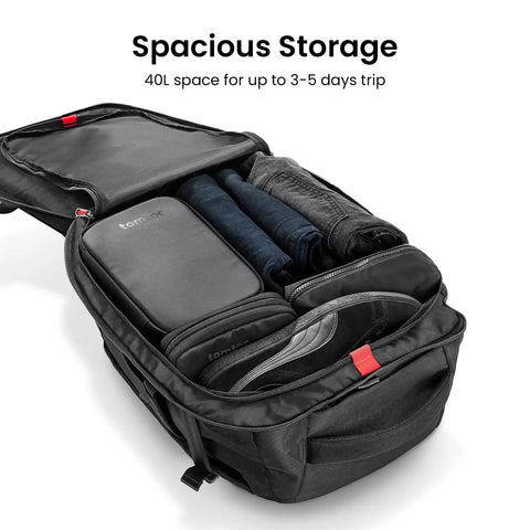 Open view of Go-To Travel Backpack 40L with clothes and 17 inch laptop sleeve, showing spacious main compartment and organizers.