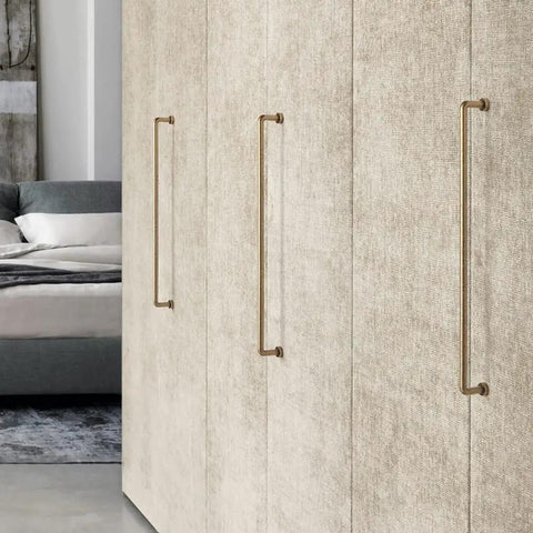 Antique Brass Retro Cabinet Pulls on textured cabinet doors in a stylish bedroom, showcasing 12 5/8 inch spacing for easy upgrade.