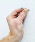 Inserting Heavy Duty Self Drilling Drywall Anchors And Screws Kit into gypsum board for easy install and strong hold