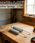 2 Pack Premium Recliner Springs 4 Inch Hook To Hook Replacement Parts Built Tough For Lazy Boy Lane Sofa Chair Mechanism Repairs on a workbench.