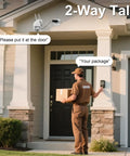 Delivery person using two-way audio feature on 4MP HD Plug In Outdoor Security Camera With Dual Band WiFi, mounted by door.