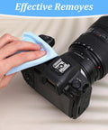 Blue microfiber cleaning cloth used to wipe a DSLR camera lens