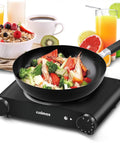 Portable 1200W Infrared Electric Stove With Quick Heat 7 Inch Ceramic Glass Burner For Dorm Office Home Or Camping Works With All Cookware Upgraded Version with a pan of vegetables on top and breakfast items.