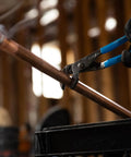 GripLock Tongue And Groove Pliers Set used on copper pipe by gloved hand, showing 6.5 Inch water pump pliers with Permalock fastener in use.