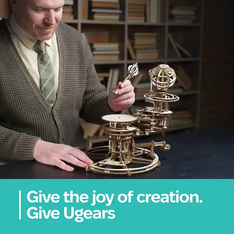 Hands On Mechanical Tellurion Three Dimensional Puzzle Wooden Model That Shows The Sun Earth Moon Cosmic Dance Explains Day And Night And Moon Phases With Realistic Orbital Motion For Science Fans And Curious Minds, man assembling wooden model
