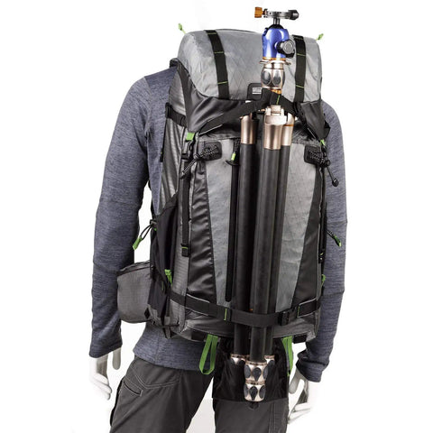 BackLight Elite 45L Camera Daypack, Rugged Grey, model wearing backpack with tripod attached, travel ready for pro gear