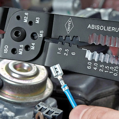 Close-up of Heavy Duty Crimping Pliers for Wire Stripping Cable Cutting and Terminal Crimping with insulated terminal in use.