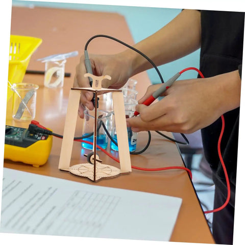 Hands assembling Stem Building Kit For 3D Compass Project Educational Science DIY Wood Craft Kit For Kids And Teens.