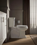 Bathroom with toilet featuring a Toilet Seat With Color Matched Hinges And Compression Molded Wood For Traditional Bathrooms, Simple Lines And Classic Look.