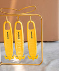 Three yellow box cutters hanging on a stand, featuring double-sided concealed blades, labeled with 'TOYUA'. Ideal for safe package opening.