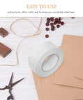 No Gimmicks Solid Grip Clear Double Sided Tape For Wall Mounting And DIY Fixes Weather Proof rolls on craft table with scissors and paper.