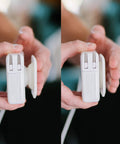 Hands holding The Side Kick Collapsible Charger Organizer And Travel Accessory For USB C Cords And MacBook And PC Chargers Cable Management White