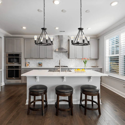 Kitchen view with 4 Light Wagon Wheel Chandelier Plug In Black Metal Pendant Light above island, modern industrial style fixture.