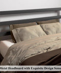 Rock Solid Queen Size Metal Bed Frame With Integrated Headboard And Reinforced Steel Slats Badass Durable Matte Black Finish close-up of headboard and pillows
