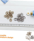 150 Pieces Mini Belt Fasteners Alloy Buckles For Sewing Crafts Small Metal Buckles With Single Prong For Doll Clothes Shoes Bags DIY Accessories And Your Go To Quick DIY Builds shown with sewing materials and ruler for scale.